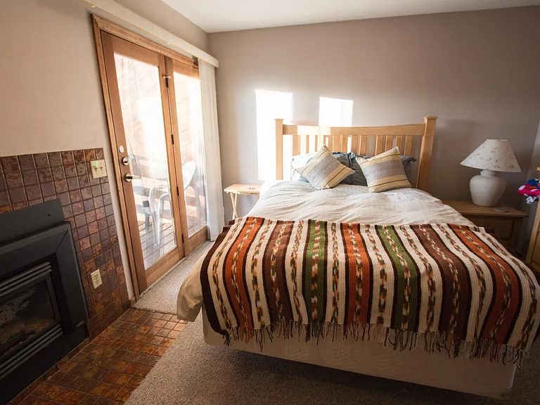 Primary bedroom downstairs with personal deck and attached full bath