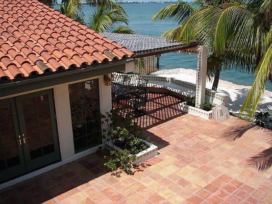 Large Mexican tile terrace overlooking open water