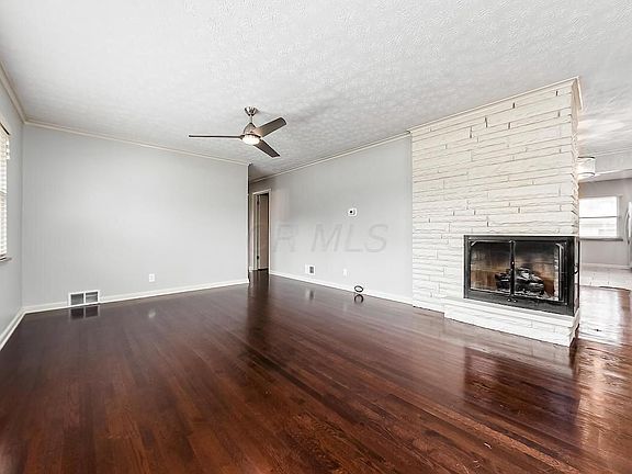 Lots of natural light, beautiful wood floors and gas fireplace in the front living area.