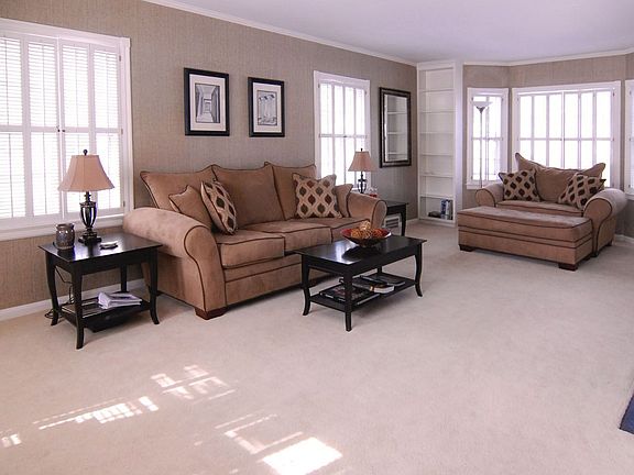 Second view of living room (hardwood under well kept carpet))