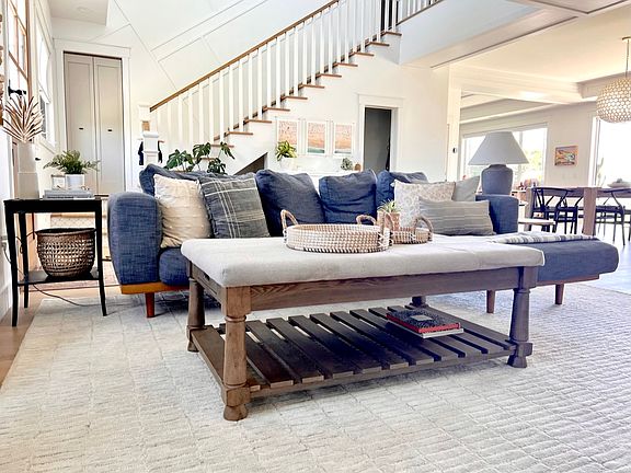 Living room opens up to the rest of the house with 10' ceilings throughout main floor and a vaulted 22' ceiling in entry way.