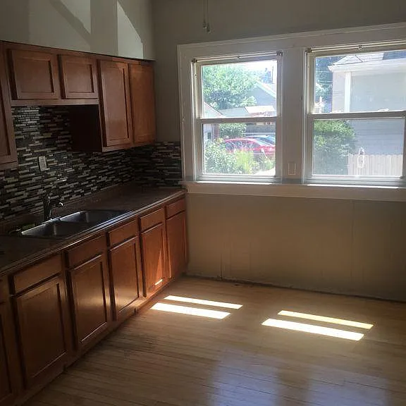 Kitchen with newer cabinets and ceiling fan