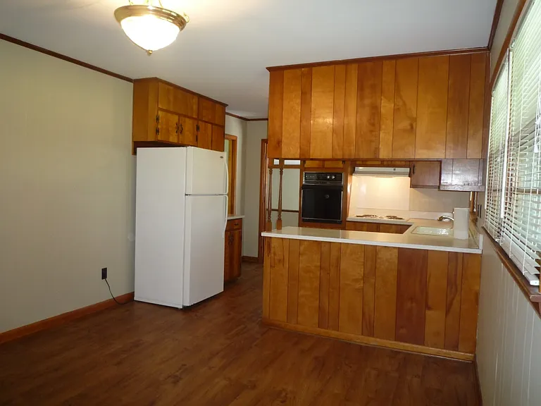 Enter from back car port into dining area with convenient coat closet on left