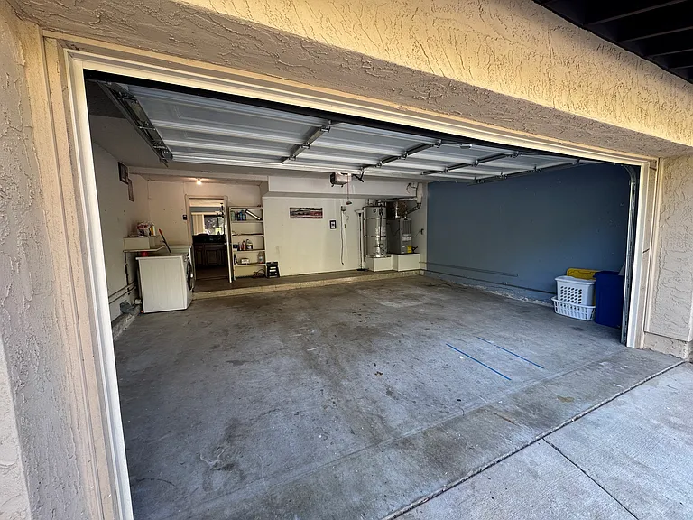 Two car garage with washer and dryer