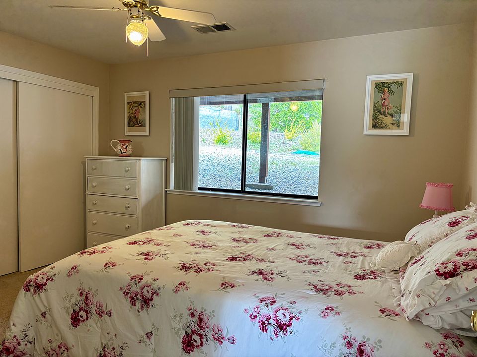 Second bedroom with closet, built-in desk, ceiling fan