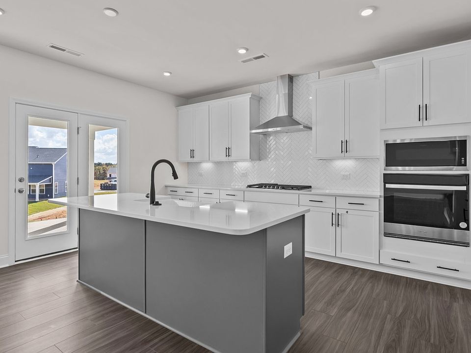 Gourmet Kitchen option with wall oven microwave and vented hood, in the Burton Design by DRB Homes i