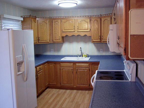 KITCHEN WITH GLASS TOP STOVE, BUILT IN MICROWAVE, FRIG WITH WATER AND ICE, LOTS OF CABINET SPACE