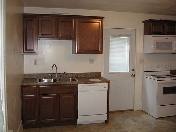 Completely updated kitchen with new appliances w/ walkout to backyard.