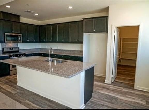Kitchen with granite countertops and upgraded maple cabinets