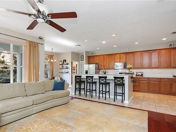 Spacious family room with beautiful Brazilian Cherry Wood floors, overlooks the huge kitchen with large Island.