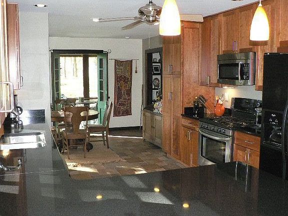 Kitchen showing french doors leading to screened porch