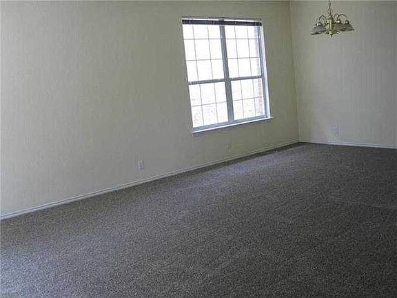 Formal dining connected to front living area.