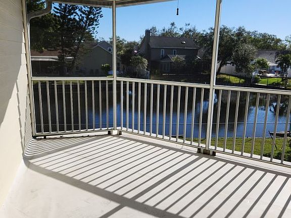 Screened balcony overlooking Willow Pond