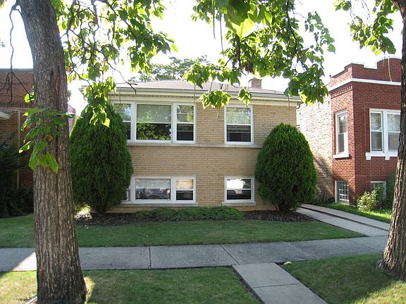 Front view of house from street. 