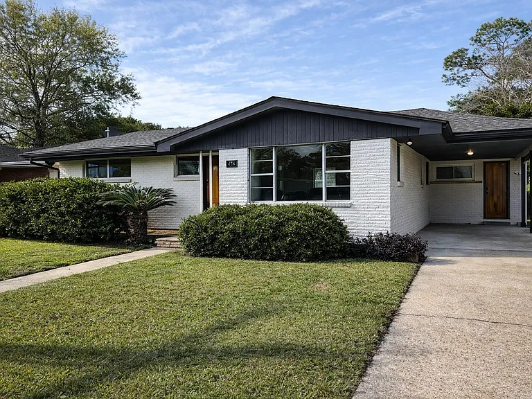 This is the front of the house with a one car carport.