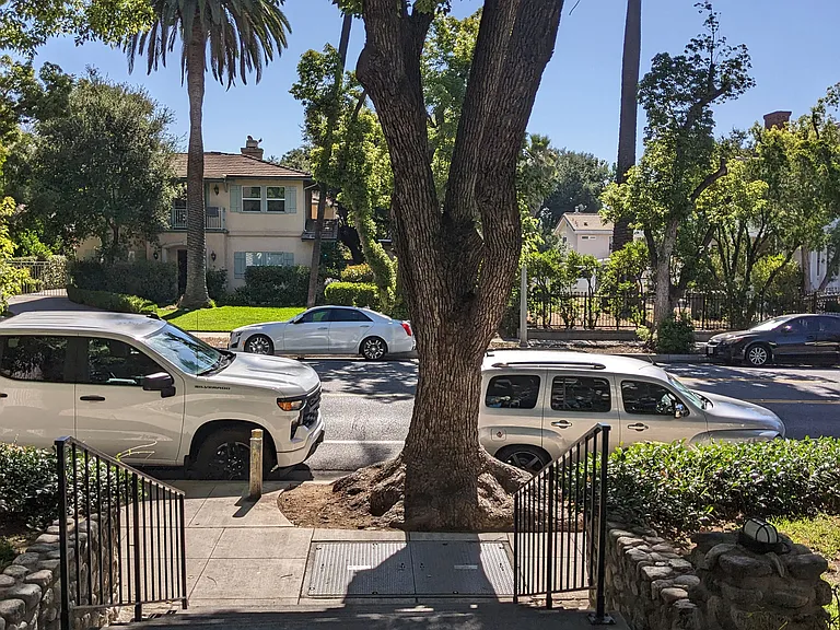 View of street from front gate of Los Robles Apartments in Pasadena, California.