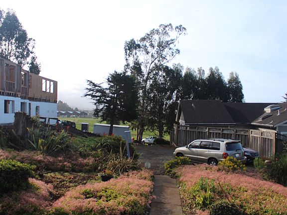 View from front door to parking area, New construction in the back ground