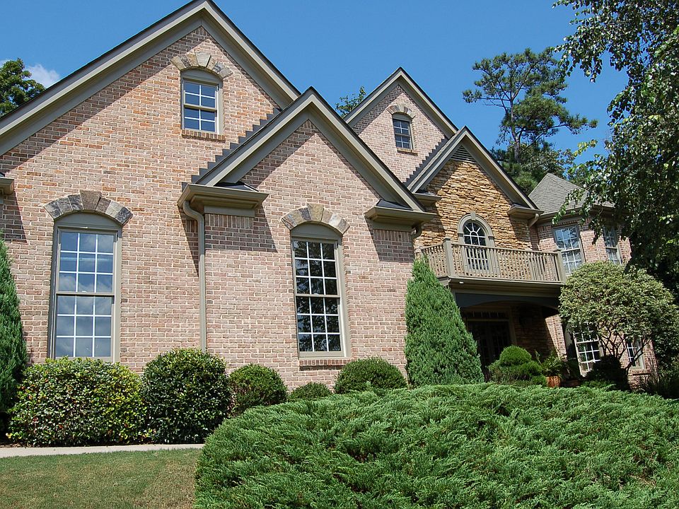  Stunning three sides brick and stone custom built home in sought community!