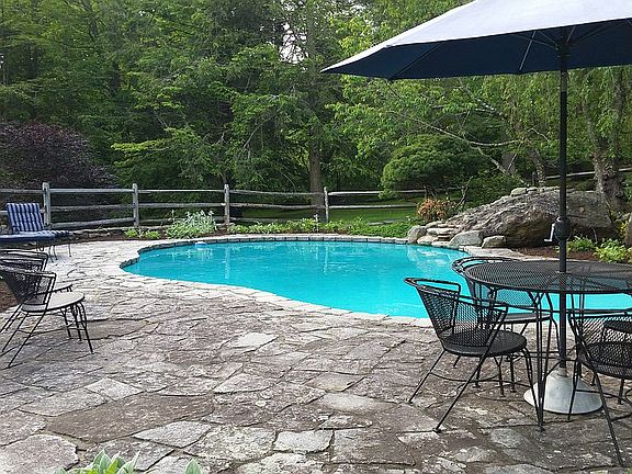 Heated pool with waterfall