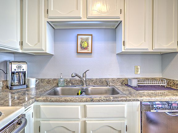 Well equipped spacious kitchen with lots of natural light.