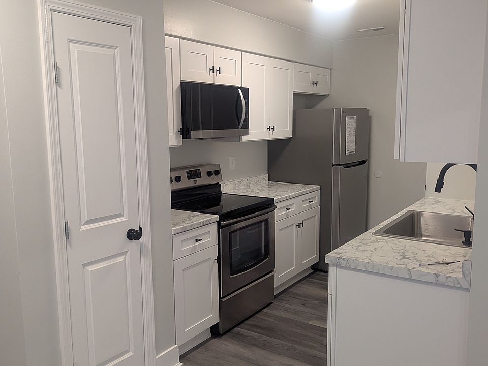 Remodeled kitchen includes a pantry (door visible on the left). New :LG Appliances, cabinets, counter tops, deep well sink and faucet.