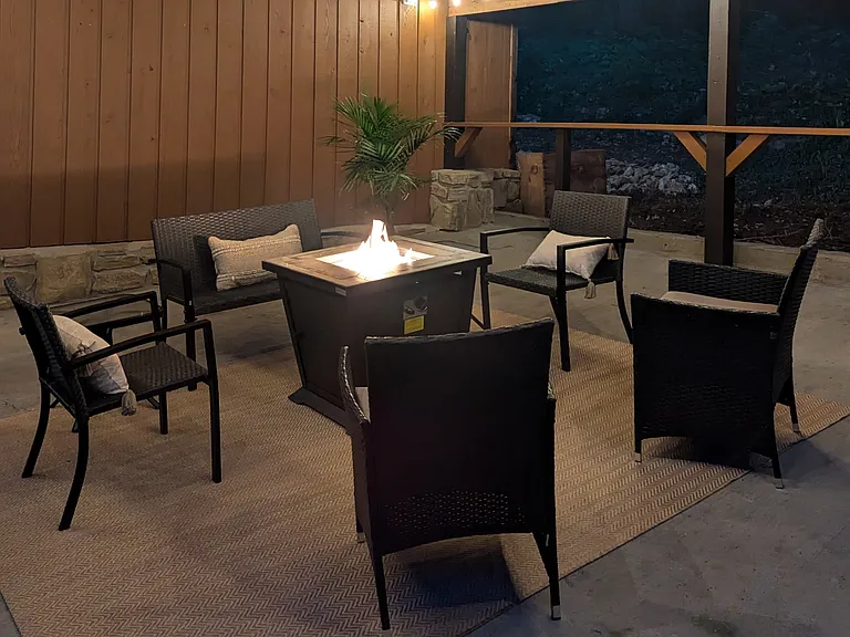 End the day relaxing around the firepit table (and you don't have to worry about smelling like smoke or building a fire - though we have that too if you'd prefer)