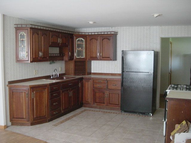Cherry wood kitchen cabinets.