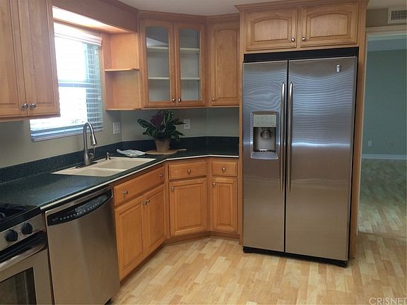 Kitchen with refrigerator included