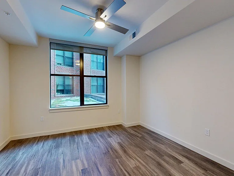 Apartment Living Room with Wood Style Flooring.