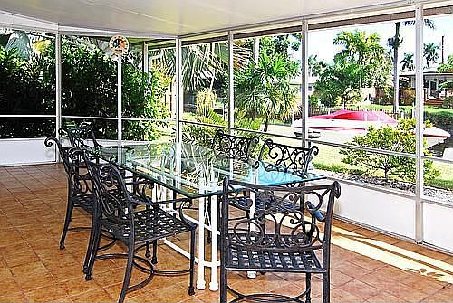Screened lanai overlooking waterfront