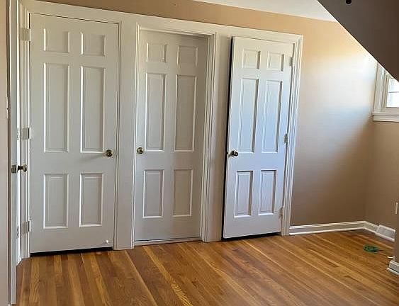 Bedroom with built in drawers, two spacious closet and an additional attic closet.