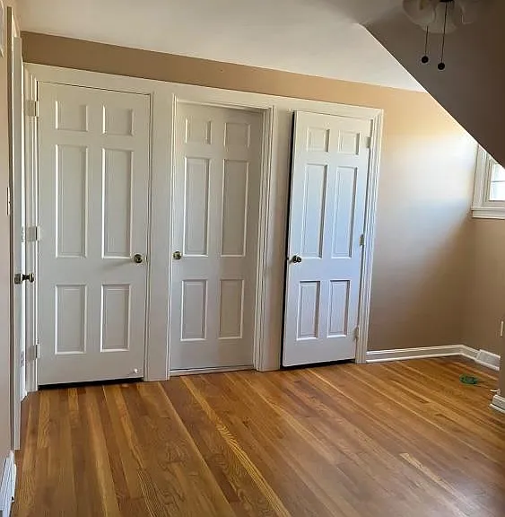 Bedroom with built in drawers, two spacious closet and an additional attic closet.