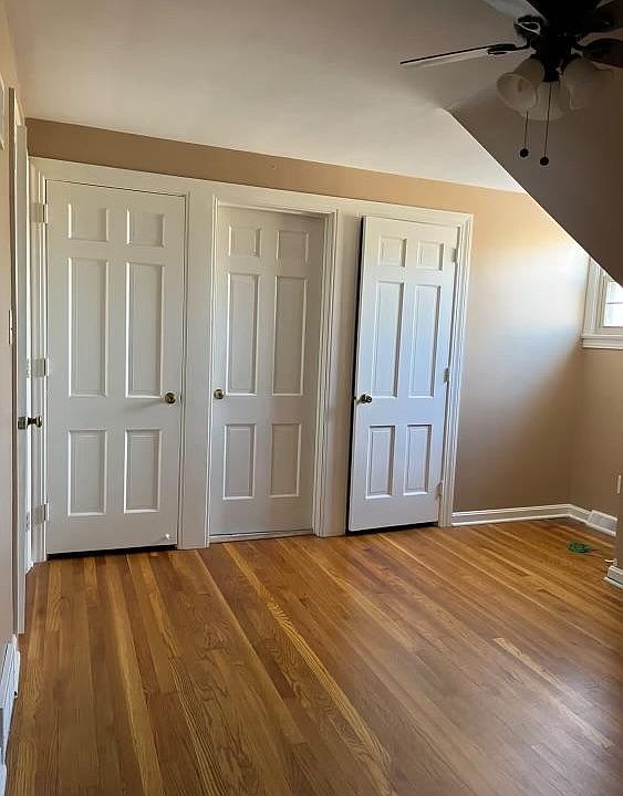 Bedroom with built in drawers, two spacious closet and an additional attic closet.