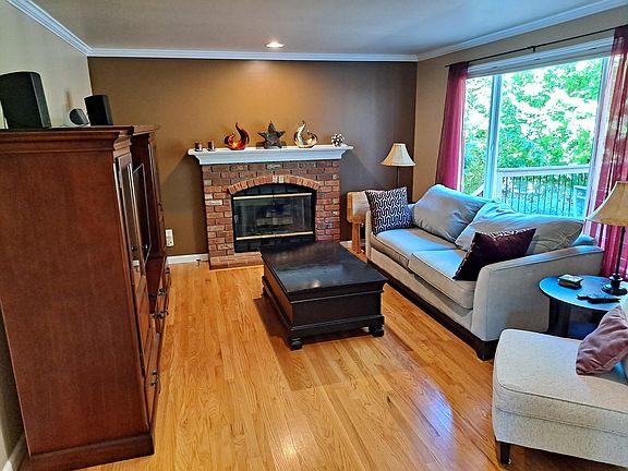 Family Room with large entertainment console, 55" LCD smart TV, DVD player and stereo system.