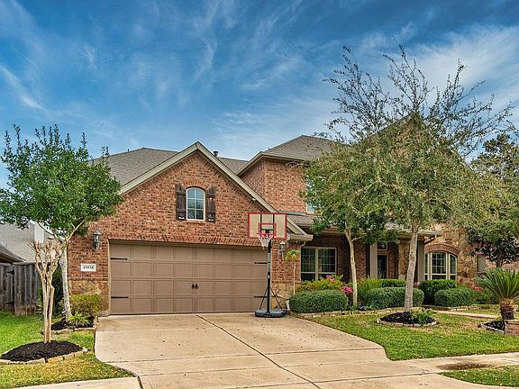 There's a double wide driveway for plenty of parking and the garage is a 3 car tandem.