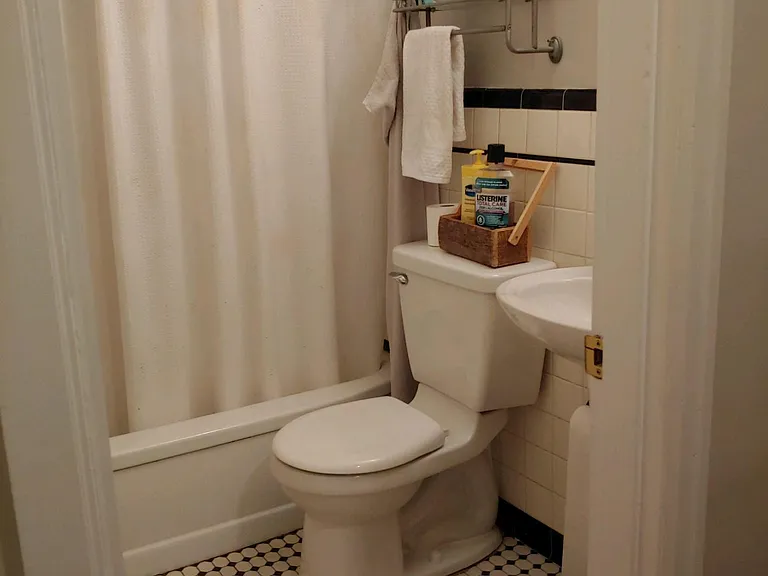 We loved this original tile on the bathroom floor and walls, so when we replumbed the entire building we took down the back bedroom wall, replumbed the bathroom and then drywalled a new bedroom wall.