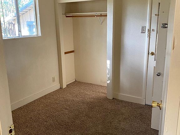 bedroom with new carpet and spacious closet