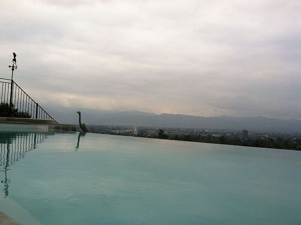 Infinity pool with view of city below