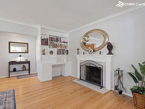 Living room showing bookcase with assortment of books