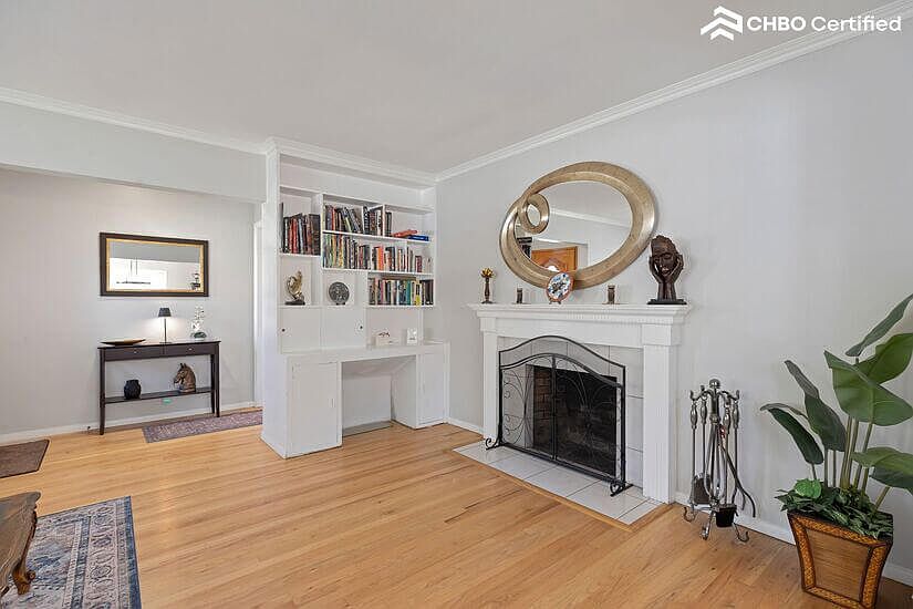 Living room showing bookcase with assortment of books
