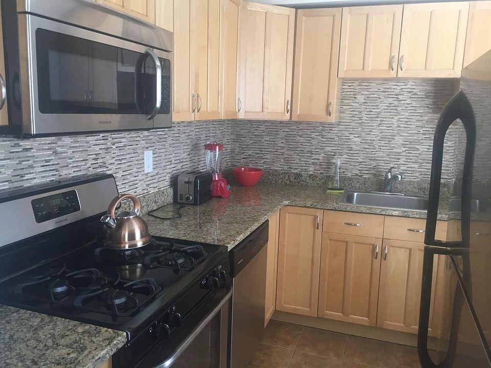 kitchen with granite countertops, featuring stainless steel appliances