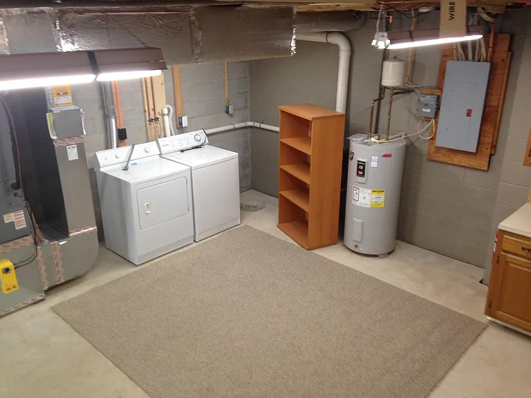 Laundry area in Full basement, New Washer