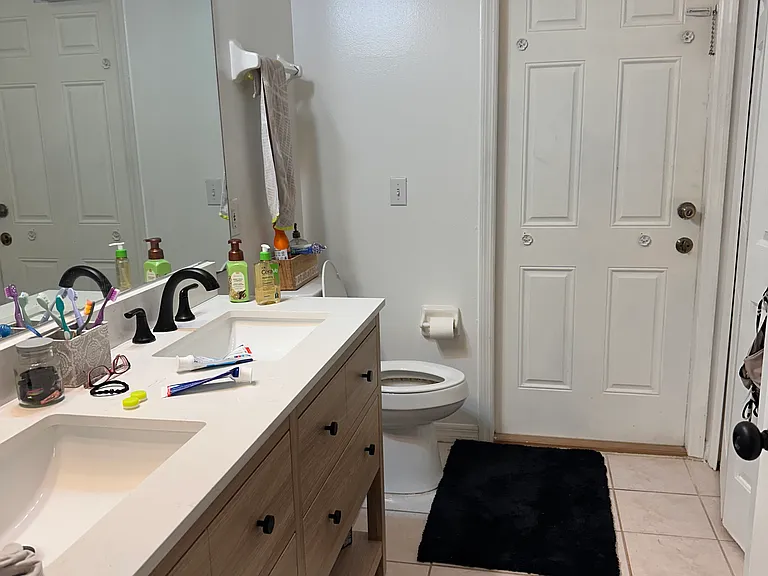 second bathroom dual sinks, and tub and shower. Access to the pool.