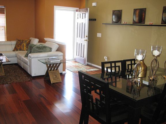 The living room/dining room with gorgeous contemporary colors and mahogany floors!