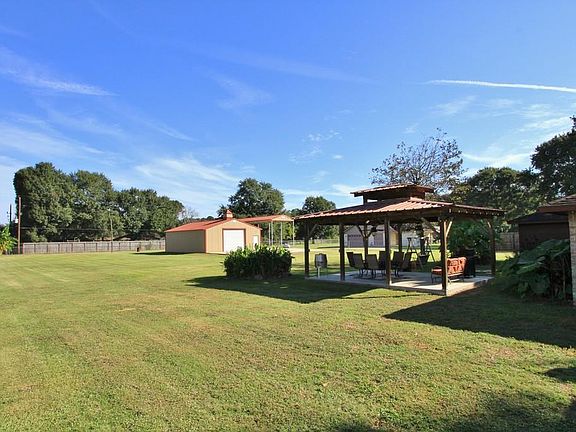 Incredible Unrestricted Property is completely fenced in the back yard.