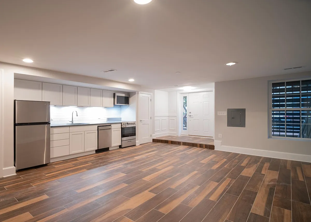 Main living space with view of kitchen and entrance - 1132 25th St NW #B