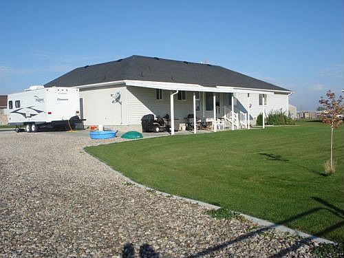 Gravel Drive way to Fenced back  yard