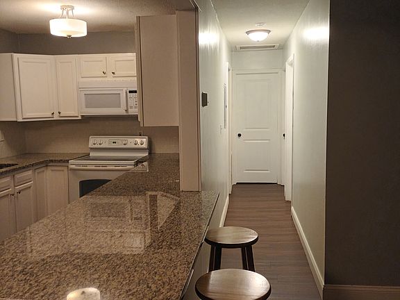 Hallway leading to bath and 3-bedrooms