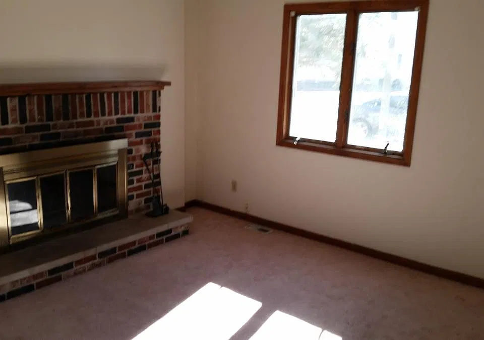 Living room with hardwood flooring (not pictured) and wbfp