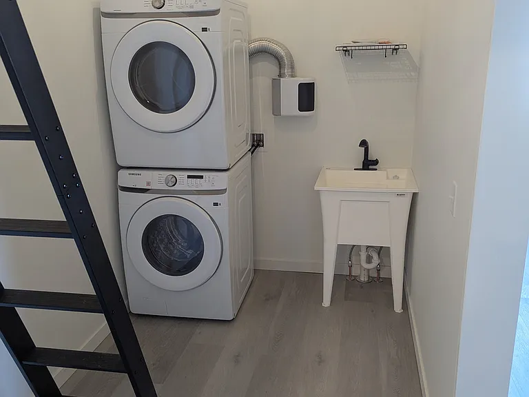 Stackable washer/dryer with utility sink